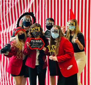 Six FCCLA students pose for a picture with photo booth props at the state contest. 